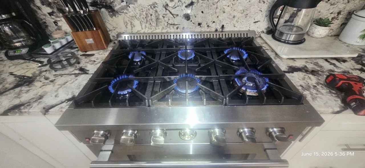 Gas cooktop burners tested during Appliance Help range service