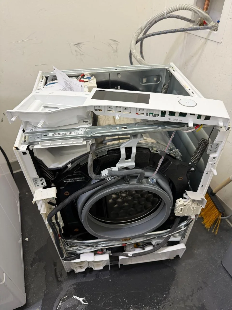 Miele front-load washer disassembled for repair and diagnostics