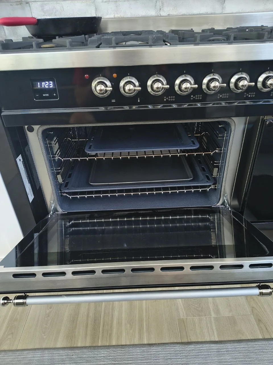 Open oven inspected during Appliance Help repair service